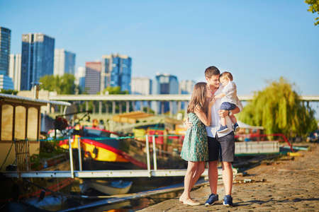 Happy family of three enjoying their vacation in Paris, Franceの写真素材