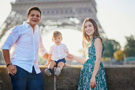 Happy family of three enjoying their vacation in Paris, Franceの写真素材
