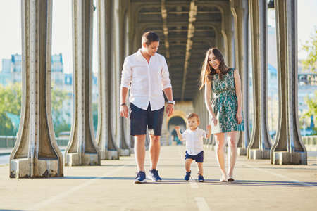 Happy family of three enjoying their vacation in Paris, Franceの写真素材