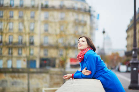 Beautiful young tourist in Paris on a fall dayの写真素材