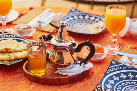 Delicious breakfast in Moroccan style served in riad (traditional Moroccan hotel)