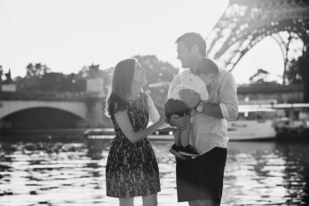 Happy family of three enjoying their vacation in Paris, Franceの写真素材