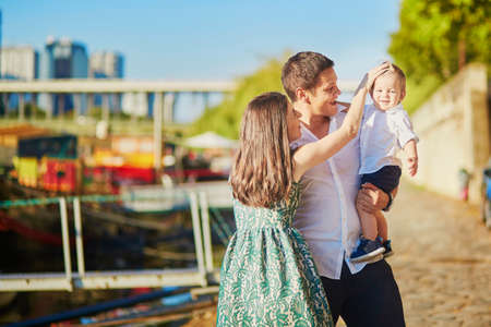 Happy family of three enjoying their vacation in Paris, Franceの写真素材