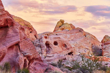Scenic landscape with multicolored sedimentary rock formations during sunset in Valley of the Fire...