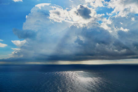Scenic landscape with dramatic sky, light beams and sea at Amalfi Coast, Campania, Italy