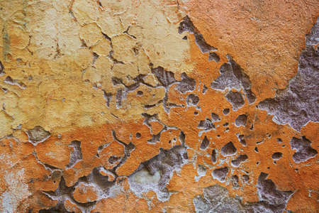 Old yellow and orange wall of a building in Rome, Lazio, Italyの写真素材