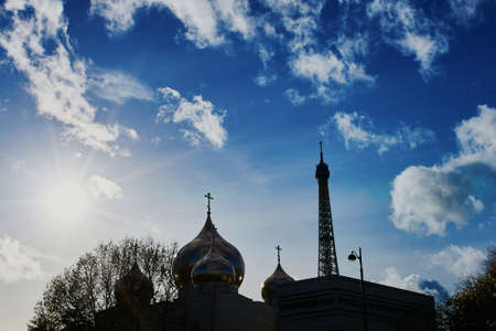 Silhouettes of domes of new Russian orthodox cathedral and the Eiffel tower in Paris, Franceの写真素材