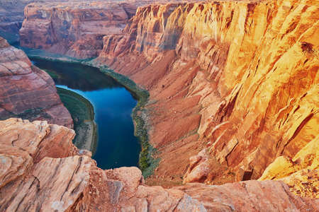 Colorado river flowing between red cliffs. Horseshoe Bend, Arizona, USAの写真素材