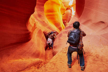 Tourist taking photo in Lower Antelope Canyon in the Navajo Reservation near Page, Arizona, USAの写真素材