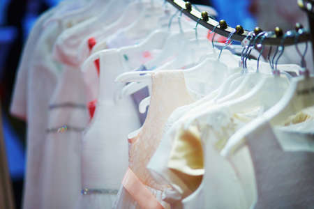 Collection of wedding or evening dresses in the shopの写真素材