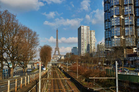Unusual view to the Eiffel tower over the rails of Parisian subway line