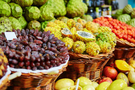 Fresh and ripe exotic fruits on traditional farmer market Mercado dos Lavradores, Funchal, Madeira island, Portugalの写真素材