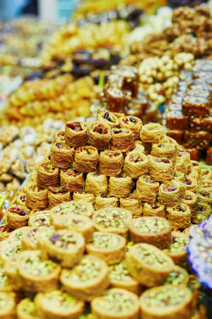 Heaps of various Turkish honey baklava on a traditional farmer market in Istanbul, Turkeyの写真素材