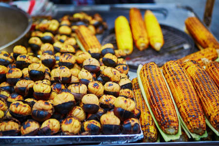 Grilled chestnuts and corn ears on a traditional farmer market in Istanbul, Turkeyの写真素材