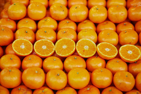 Large heap of fresh ripe organic oranges on farmer market in Paris, Franceの写真素材