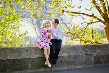 Romantic loving couple near the Eiffel tower in Paris, Franceの写真素材