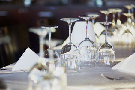 Many empty glasses in a restaurant