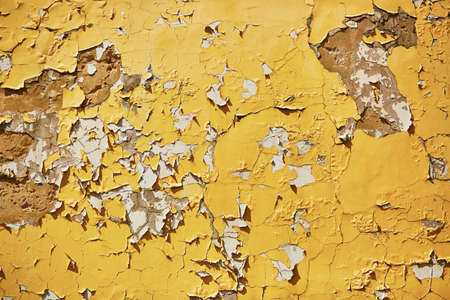 Old weathered yellow wall background