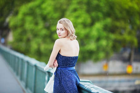 Beautiful young elegant French woman in Paris outdoorsの写真素材