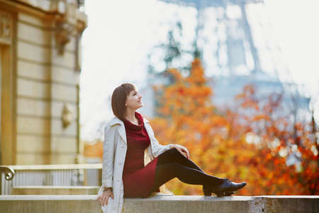 Beautiful young woman in Paris on a bright fall dayの写真素材