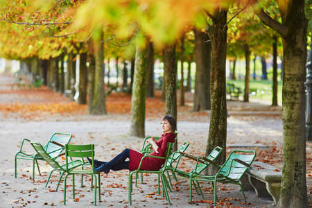 Beautiful young woman in Paris on a bright fall dayの写真素材