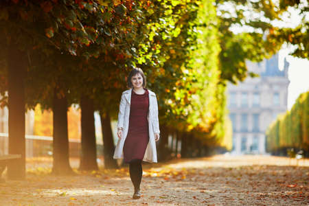 Beautiful young woman in Paris on a bright fall dayの写真素材