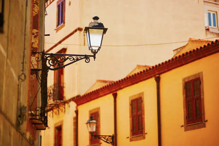 Typical colorful Italian houses on a street of Bosa, Sardinia, Italyの写真素材