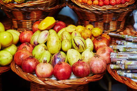 Many fresh and ripe exotic fruits on traditional farmer market Mercado dos Lavradores, Funchal, Madeira island, Portugalの写真素材