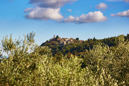 Scenic Tuscan landscape with small village on top of hill. San Quirico d'Orcia, Tuscany, Italyの写真素材
