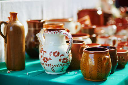 Handmade ceramic jugs sold on Easter fair in Vilnius, Lithuania. Traditional Lithuanian spring fairの写真素材