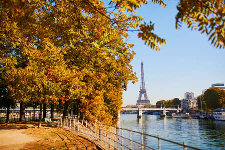 Scenic view of the Eiffel tower over the river Seine on a bright fall day in Paris, Franceの写真素材