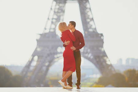 Romantic couple in love near the Eiffel tower in Paris, Franceの写真素材