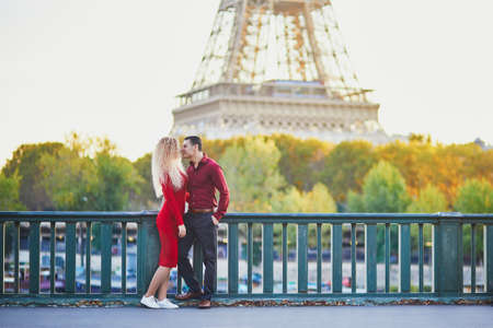 Romantic couple in love near the Eiffel tower in Paris, Franceの写真素材
