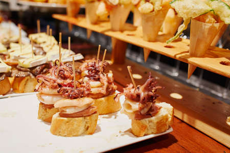 Variety of pinchos (pintxos) in a bar of San Sebastian (Donostia), Spainの写真素材