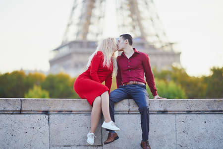 Romantic couple in love near the Eiffel tower in Paris, Franceの写真素材