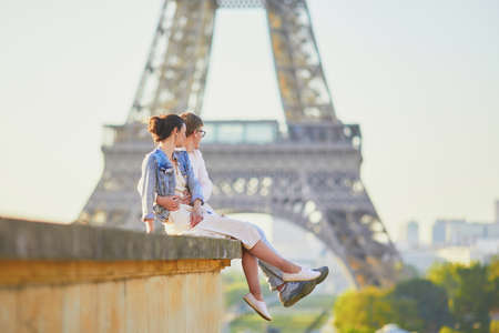 Happy romantic couple in Paris, near the Eiffel tower. Tourists spending their vacation in Franceの写真素材