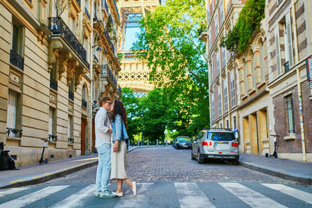 Happy romantic couple in Paris, near the Eiffel tower. Tourists spending their vacation in Franceの写真素材