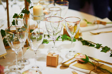 Beautiful table set with candles and flowers for a festive event, party or wedding receptionの写真素材