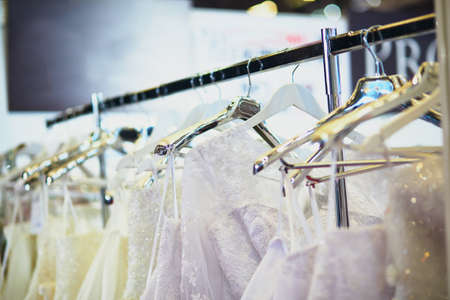 Collection of elegant wedding dresses in the shop