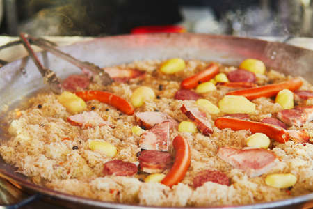 Delicious sauerkraut with smoked sausages on traditional Christmas market in Paris, Franceの写真素材