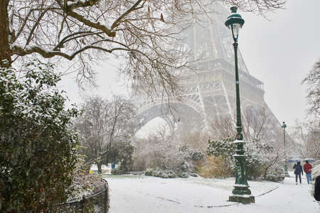 Scenic view to the Eiffel tower on a day with heavy snow. Unusual weather conditions in Parisの写真素材