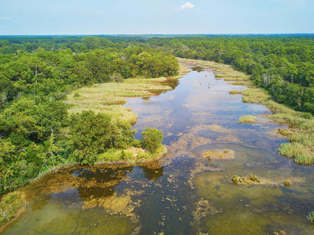 Scenic aerial view of the Atlantic ocean coast and estuary of Ruisseau de cires in Saint-Brice, Gironde, Franceの写真素材
