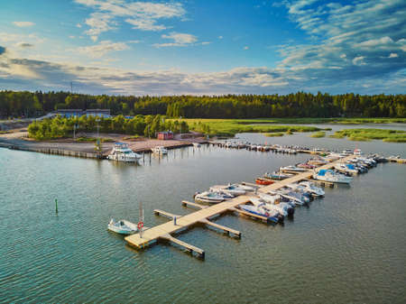 Scenic aerial view of colorful boats near wooden berth in the countryside of Finlandの写真素材