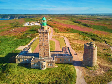 Scenic view of Cape Frehel with its lighthouse, one of the most popular tourist destinations in Brittany, France. Aerial drone view of widely known tourist attraction along famous GR34 tracking pathの写真素材