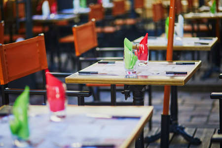 Table of traditional Parisian outdoor cafe. Empty restaurant waiting for clients in Paris, Franceの写真素材