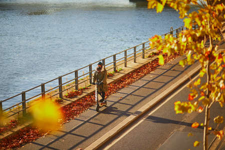 PARIS, FRANCE - NOVEMBER 4, 2020: People riding bikes on Seine embankment in Paris, Franceのeditorial素材
