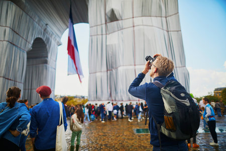 PARIS, FRANCE - SEPTEMBER 26, 2021: Triumphal Arch wrapped in silvery blue fabric and red rope as a posthumous project planned by the artists Christo and Jeanne-Claudeのeditorial素材