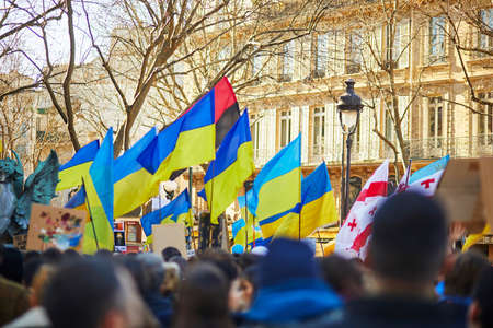 Paris, France - February 27, 2022: Massive manifestation against war in Ukraine on Place...