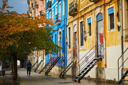 BILBAO, SPAIN - NOVEMBER 3, 2021: Colorful buildings on a street of Bilbao, Basque Country, Spainのeditorial素材