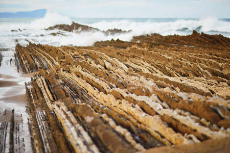 Famous flysch of Zumaia, Basque Country, Spain. Flysch is a sequence of sedimentary rock layers that...